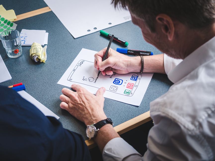 UX UI ecommerce prototype designer sketching mobile storefront - UX UI ecommerce prototype